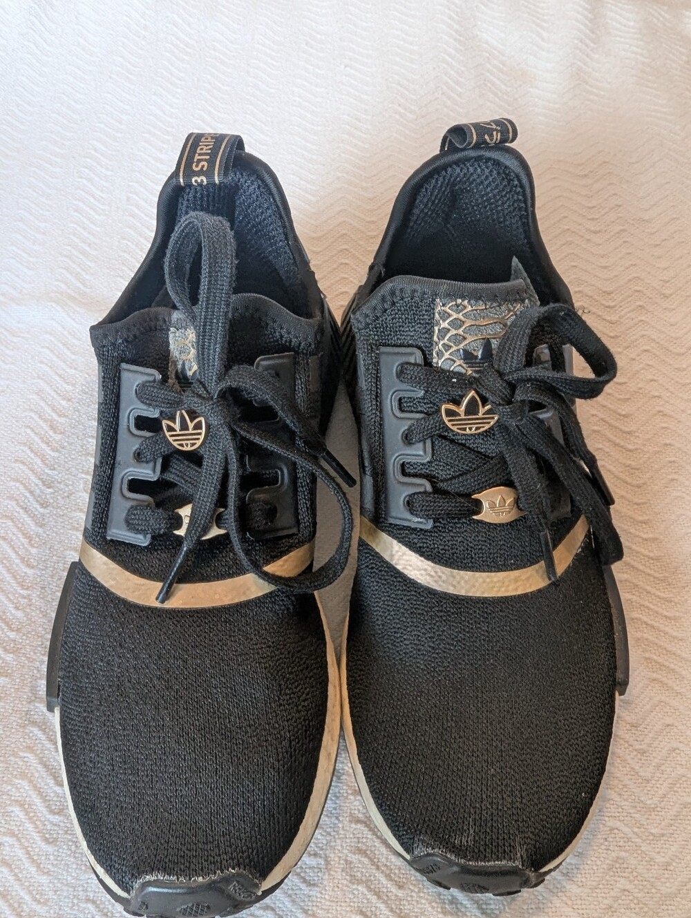 adidas Black Sneakers with Gold Accents and Trefoil Charm